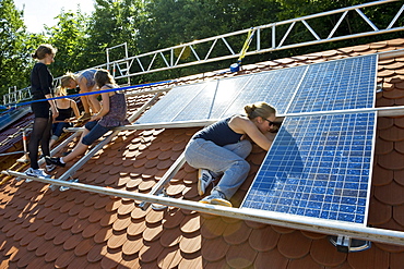 School project, students installing a solar plant, Freiburg im Breisgau, Black Forest, Baden-Wuerttemberg, Germany, Europe