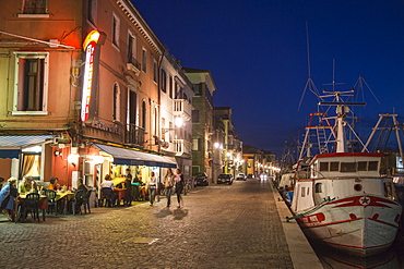 Ristorante Pizzeria Al Porto and fishing boats at dusk, Chioggia, Veneto, Italy, Europe