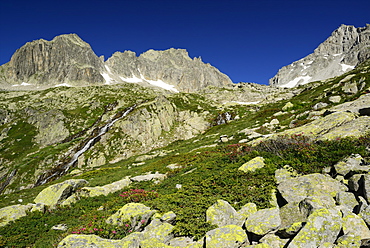 High mountain landscape with boulders and stream, Alpe di Rotondo, Gotthard range, Ticino, Switzerland