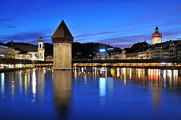 Illuminated Kapellbruecke bridge in the evening, Luzern, Switzerland, Europe