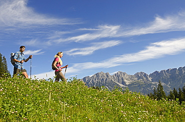 Hikers on Hausberg mountain, Hartkaiser, View towards Wilder Kaiser, Tyrol, Austria