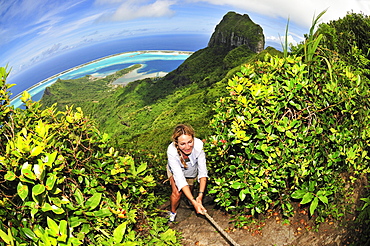 Woman trekking up Mount Pahia, Bora Bora, Society Islands, French Polynesia, Windward Islands, South Pacific