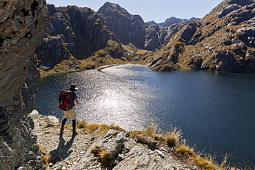 Hiker on the Routeburn Track at Lake Harris, Great Walk, Mount Aspiring National Park, Fiordland National Park, South Island, New Zealand