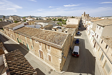 Carrer de Sala, village road leads to parish church in the centre of Porreres, southern island, Mallorca, Balearic Islands, Spain