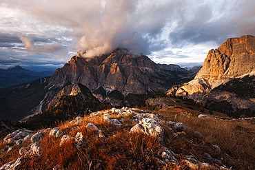 Dramatic atmosphere above the southern Fanes nature park in the Dolomites with the view to Piz dles Conturines in last sunlight, Belluno, Italy