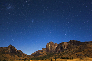 Southern starry Sky with the Magellanic Clouds over the Tsaranoro Mountain Range, South Madagascar, Africa