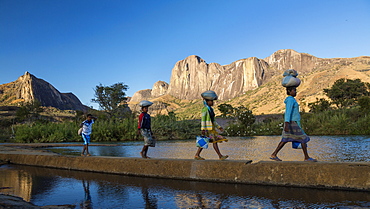 Madagascan girls in front of the Tsaranoro Massif, highlands, South Madagascar, Africa