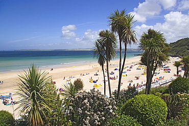 People sunbathing at Porthminster Beach, St. Ives, Cornwall, England, United Kingdom