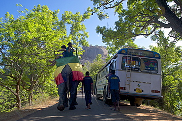 Elephant with tourists passing bus at Sigiriya, Matale Distict, Cultural Triangle, Sri Lanka, South Asia