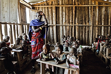 Children and teacher in a Massai village school, Kenya, Africa