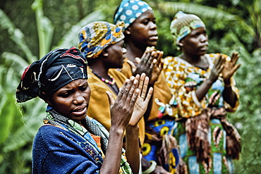 Women in a Pygmy village singing and clapping, Lake Bunyonyi, Uganda, Africa