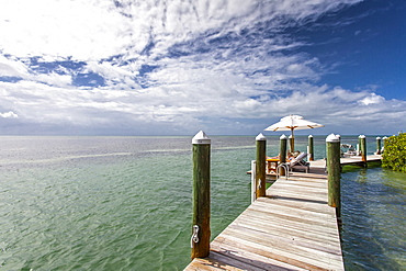 Landing stage with tourists sunbathing, Little Palm Island Resort, Florida Keys, USA