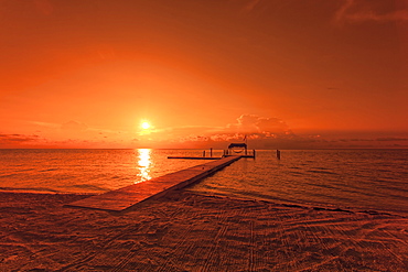 Beach with landing stage in the morning light at sunrise, Moorings Village Resort, Islamorada, Florida Keys, Florida, USA