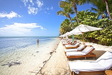 Beach with tourists, Little Palm Island Resort, Florida Keys, USA