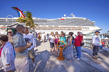 Tourists in front of luxury cruise ship docked at the port of Key West, Florida Keys, Florida, USA