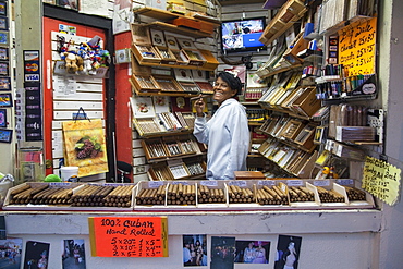 Woman selling cigars in a tobacco shop on Duval Street, Key West, Florida Keys, USA