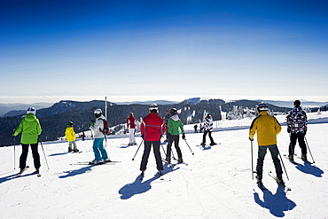 Skiers on the summit of Feldberg, Black Forest, Baden-Wuerttemberg, Germany