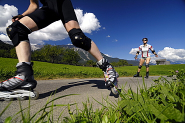 Couple on inline skates, Inline skating, near Imst, Tyrol, Austria