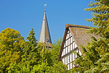 Church tower of the Roman church from about 1200 and thatched house at Mehren near Altenkirchen, Westerwald, Rhineland-Palatinate, Germany, Europe