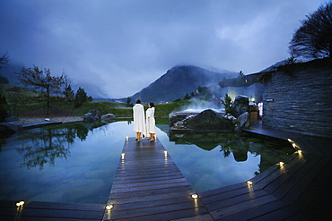 Hotel guests on a jetty at a natural source pond, Tannheim, Tannheim Valley, Tyrol, Austria