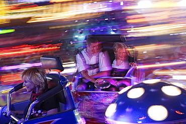 People at Carnival ride in the evening, Oktoberfest, Munich, Bavaria, Germany