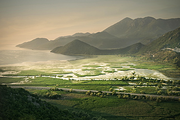 Dramatic morning light with view of Virpazar, the lake and mountains, Lake Skadar National Park, Montenegro, Western Balkan, Europe