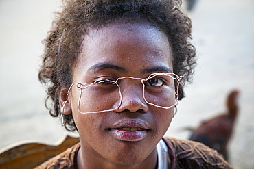 Boy with self-made glasses, Bara people, Ranohira, highlands, Madagascar, Africa