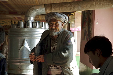 Afghan doctor dispensing medicines at a restaurant in Bamiyan, Bamian Province, Afghanistan