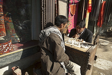 Afghan men playing chess on Chicken Street in Kabul, , Afghanistan