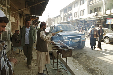 Man preparing kebabs at a Kabul restaurant, , Afghanistan