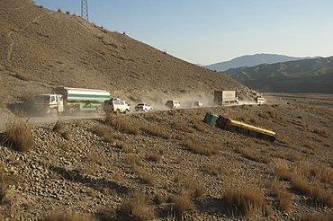 The overturned tanker truck couldn't handle the traffic on the dusty Kabul to Sarobi Road, Kabul Province, Afghanistan