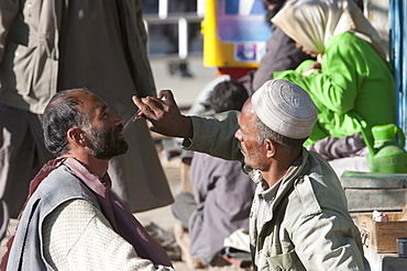 Afghan barber in Charikar, Parwan Province, Afghanistan