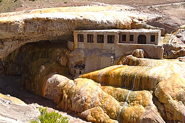 Former spa by Puente del Inca, a natural arch that forms a bridge with sulphur deposits over the Vacas River, a tributary of the Mendoza River, Mendoza, Argentina