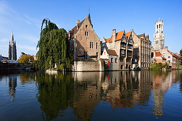 Medieval houses and Belfort (Belfry) reflected in a canal, as seen from Rozenhoedkaii, Bruges (Brugge), West Flanders, Belgium