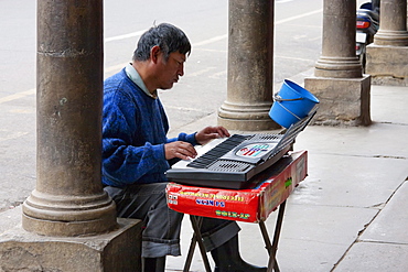 Blind man playing an organ, Cochabamba, Bolivia