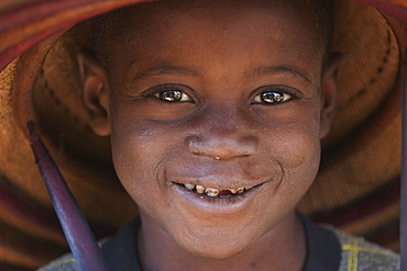 Dogon boy wearing a hat in Tireli, Mali