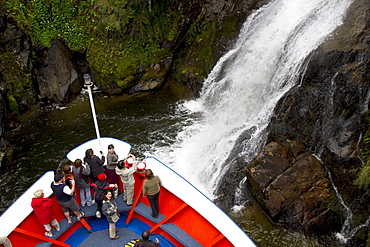 MV Skorpios next to a waterfall in Quitralco Fjord, AisâˆšÂ©n Region, Chile