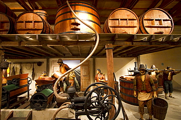 Life size handcrafted wooden figures illustrate the various stages of winemaking and distilling, as practiced in the 1900s, on display at the Wine Museum of Estancia El Cuadro, Casablanca Valley, Valparaiso Region, Chile