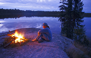 Man Sitting by Campfire, Wanzatika Lake, Northern Ontario