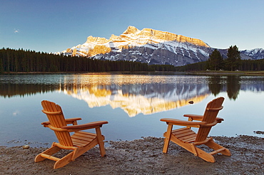 Muskoka Chairs in front of Mt Rundle and Two Jack Lake, Banff National Park, Alberta.