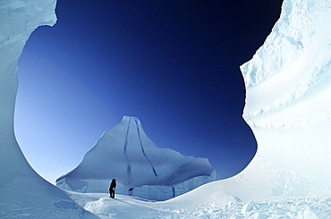 Person standing on huge Iceberg, Grise Fiord, Nunavut.