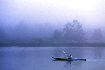 Kayaker in morning Fog, Georgian Bay Ontario.