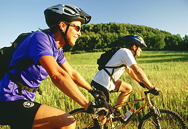 Couple Biking Through Country