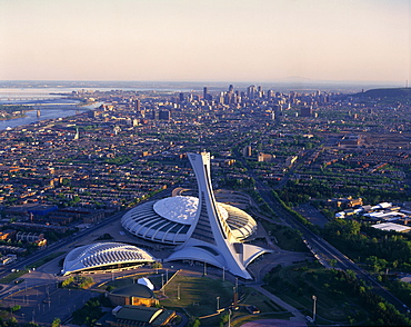 Aerial view of Olympic Stadium and Downtown at Sunset, Montreal, Quebec.