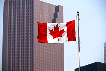 Canadian Flag with City Buildings in background, Toronto, Ontario