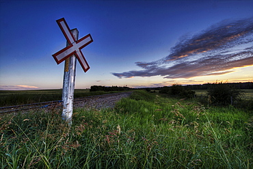 Railway crossing on a summer evening south of Bon Accord, Alberta.