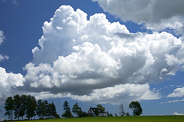 House and summer thunderclouds, Little Shemogue, New Brunswick.