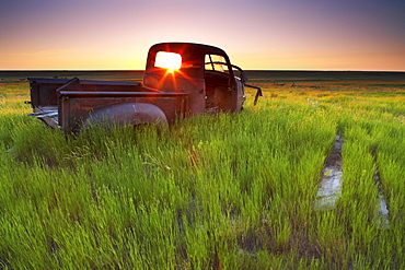 Old Abandoned Pick-Up Truck Sitting in a Field at Sunset, Southwestern Saskatchewan