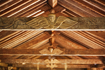 Carved wooden angels in the Mestizo-Baroque style on an original support beam of the Jesuit Mission of Santa Ana de Velasco, Santa Cruz Department, Bolivia