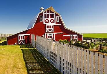 Red barn with fence, near Lake Alma, Saskatchewan